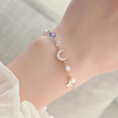 Pulsera luna de zirconias, perlas y link estrella