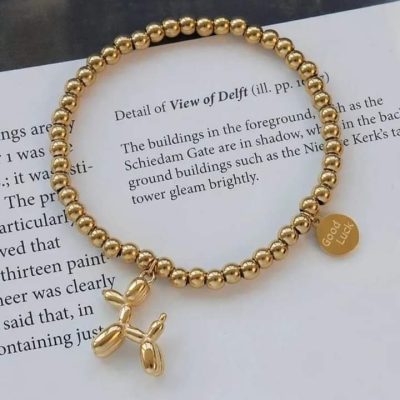 Pulsera de perrito elástica dorada - Imagen 2
