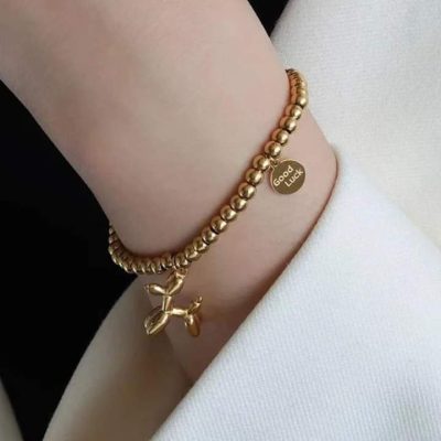 Pulsera de perrito elástica dorada