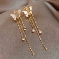 Aretes largos de doble mariposa