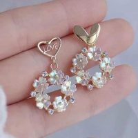 Aretes de corazon y flores dorado